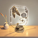Decorative lamp with feathers on a wooden surface