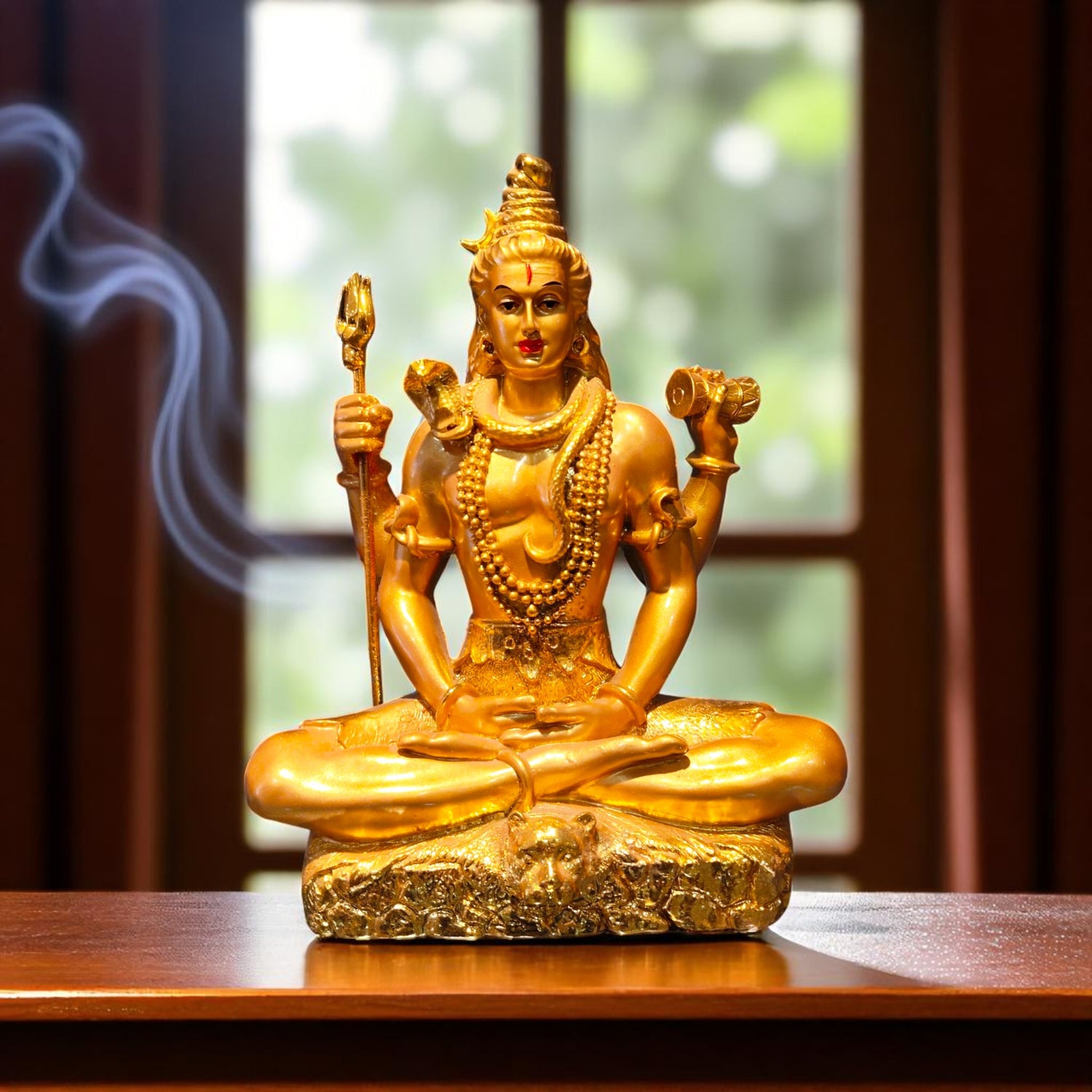 Front view of Golden Lord Shiva idol in meditation pose with trishul and damru – perfect for pooja decor