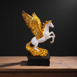 Front view of golden winged Pegasus flying horse showpiece
