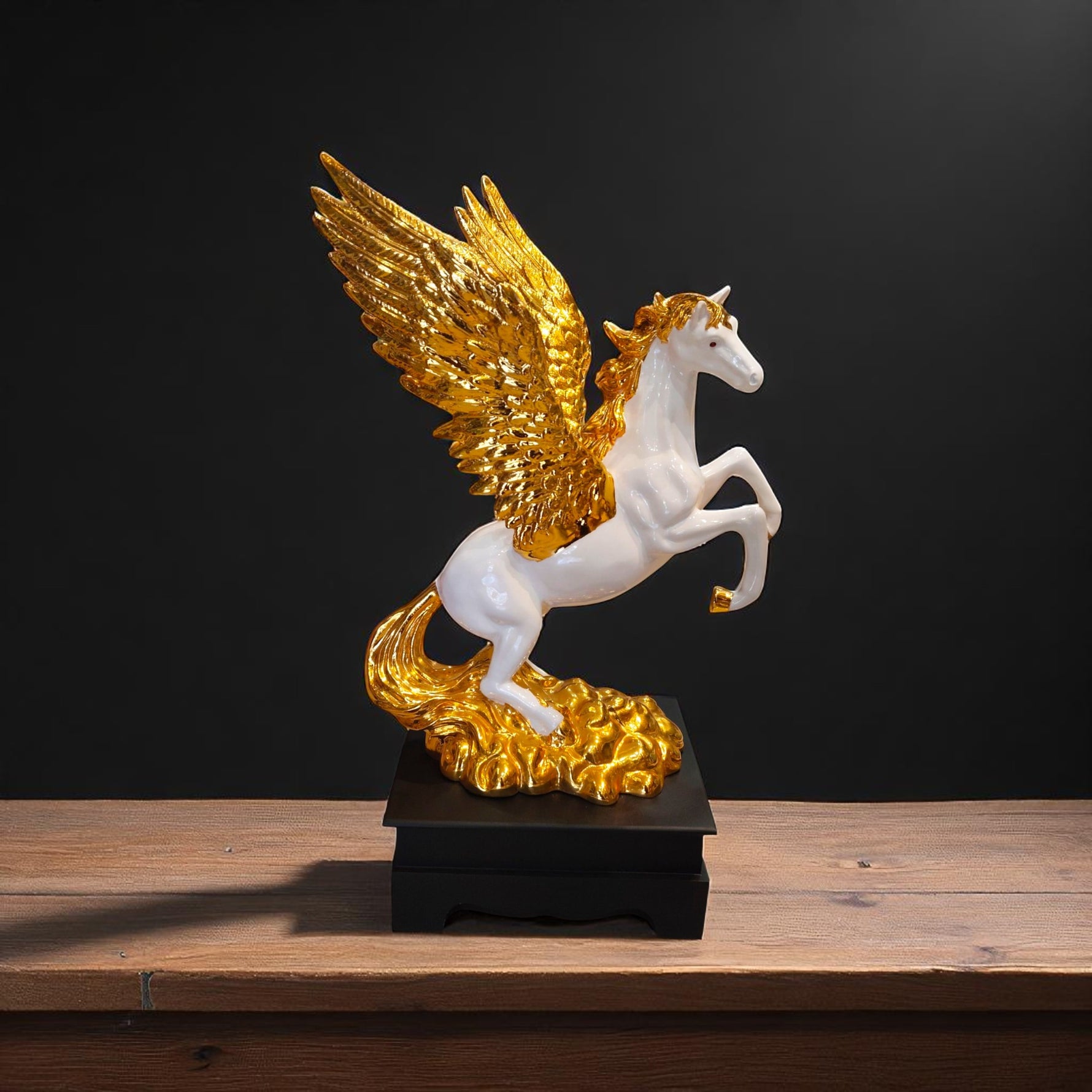 Front view of golden winged Pegasus flying horse showpiece