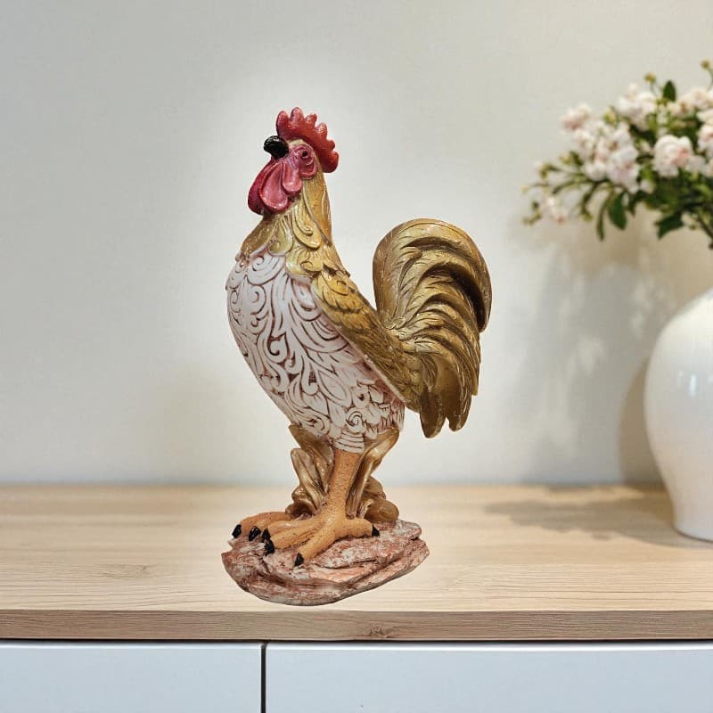 Decorative rooster figurine on a wooden surface with a blurred background