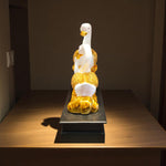 Rear view showing intricate golden tail details of swan figurine