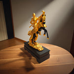  Side view of metallic golden horse and rider home decor showpiece