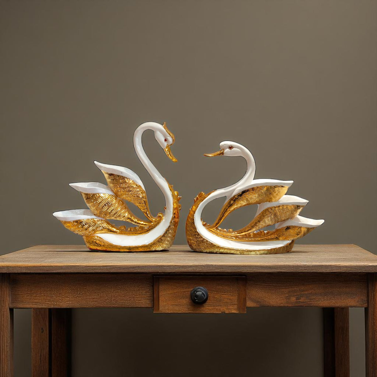 Swan showpieces hanging with artistic golden feather design