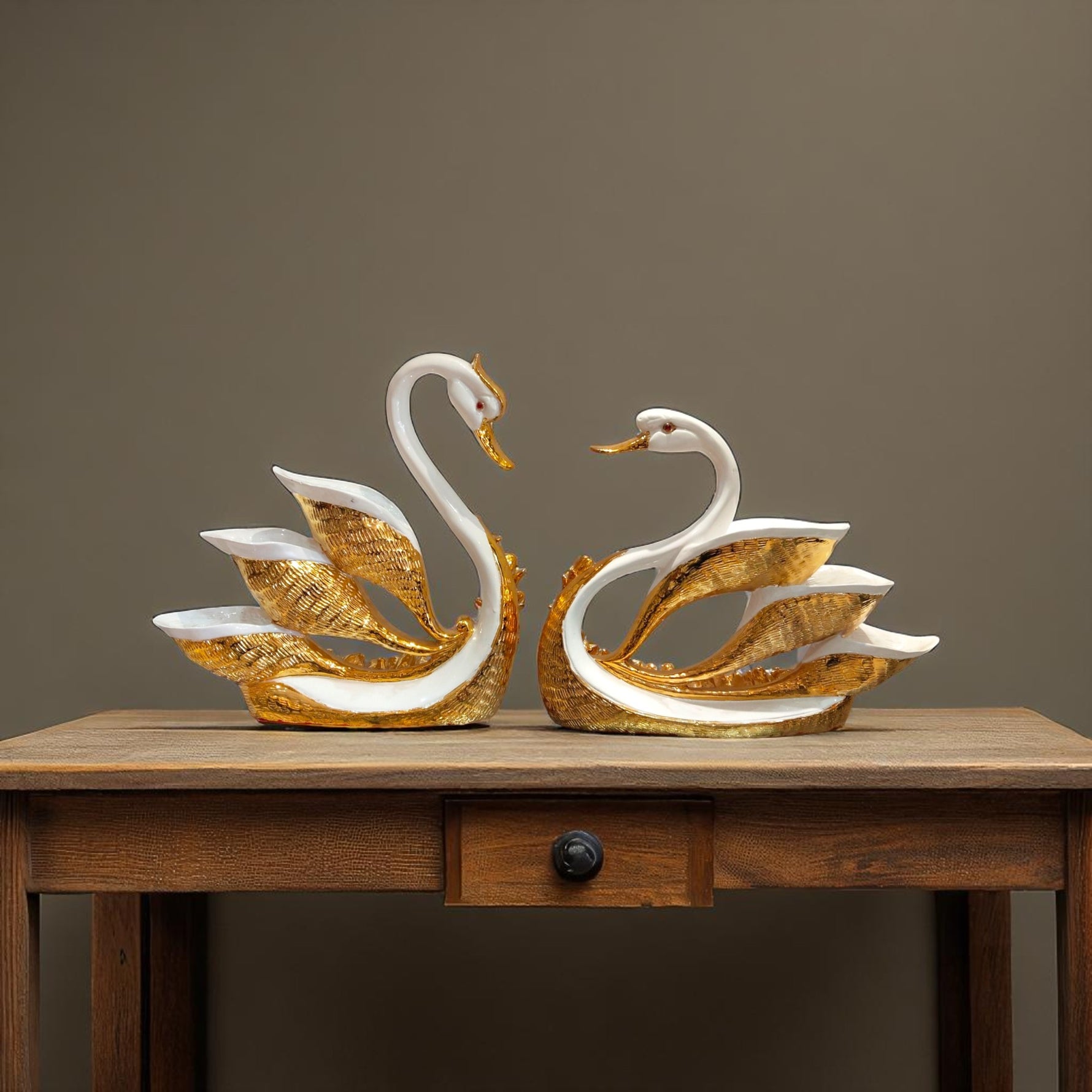 Swan showpieces hanging with artistic golden feather design