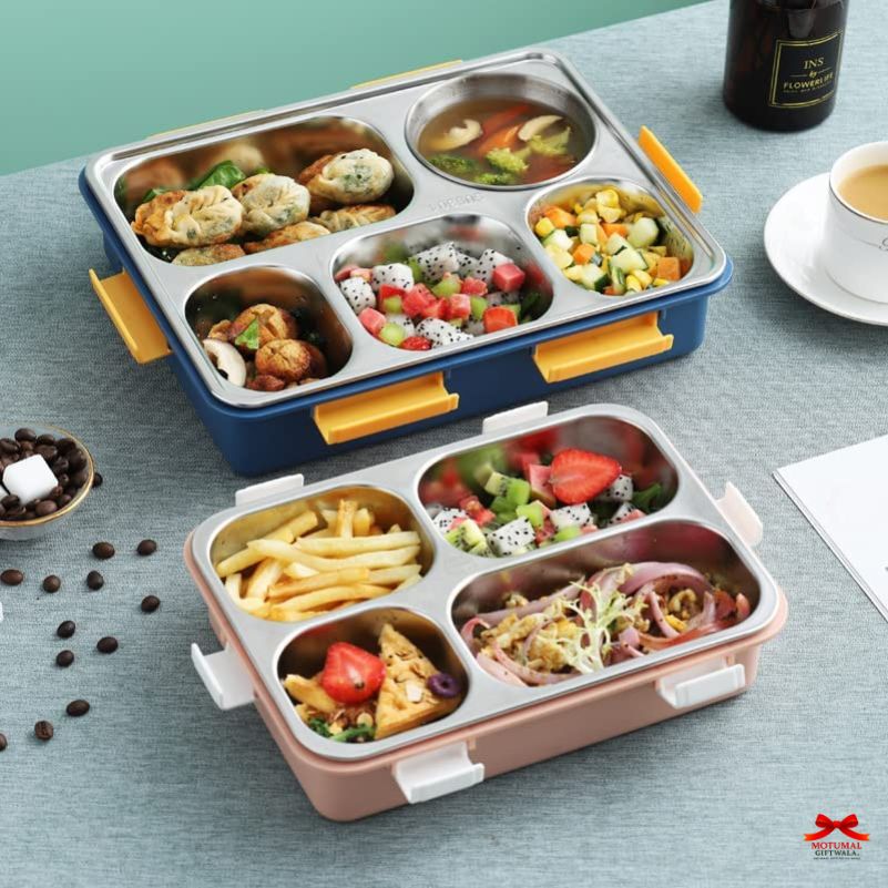 Two compartmentalized lunch boxes with food on a table