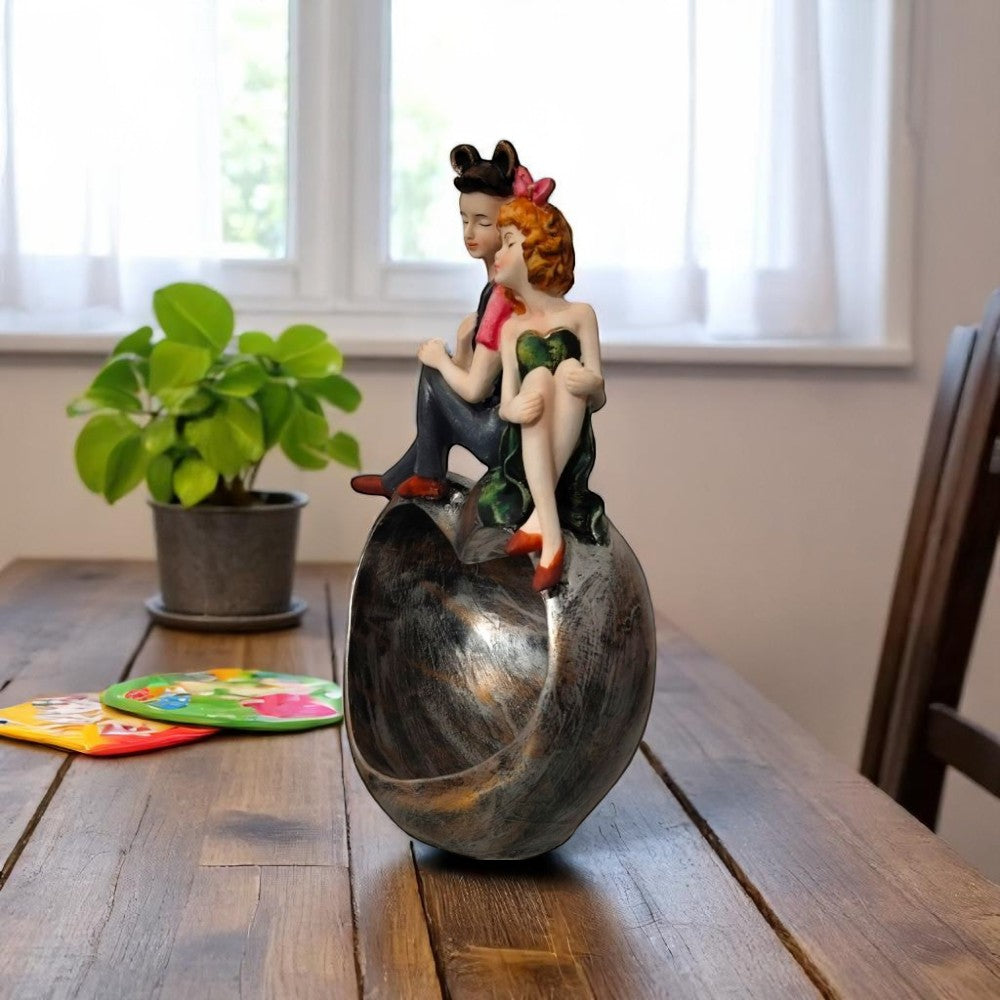 Side angle of romantic couple showpiece on heart bowl