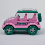 Pink toy car with green accents and 'Jeep' branding on a gray background