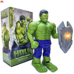 Toy figure of a green superhero with a glowing weapon next to its packaging