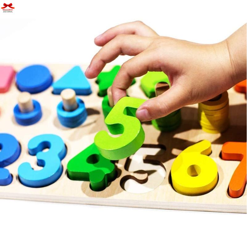 Child's hand placing a green number piece on a wooden number puzzle.