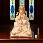  Front view of white and golden Maa Lakshmi idol with lotus and coins