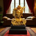 Front view of Dancing Laughing Buddha with fish base in golden white finish