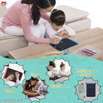 Woman and child using a digital drawing board with colorful pens on a table.