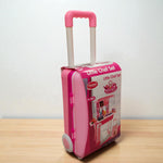 Back of Little Chef Set toy kitchen suitcase showing assembly instructions and contents.