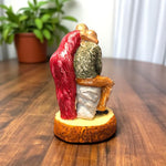 Red saree woman hugging man from behind – rear view of couple statue