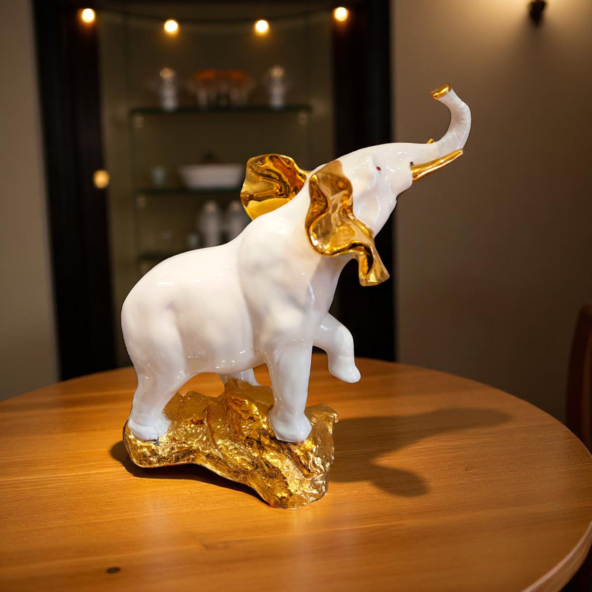 Side angle of good luck white elephant showpiece on golden base