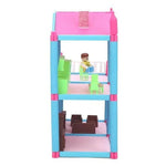 Toy dollhouse with pink roof and blue body on a white background