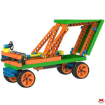 Colorful toy construction set with green baseplate, orange beams, and black wheels on a white background.