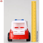 Toy ambulance with a ruler for size reference on a gray background