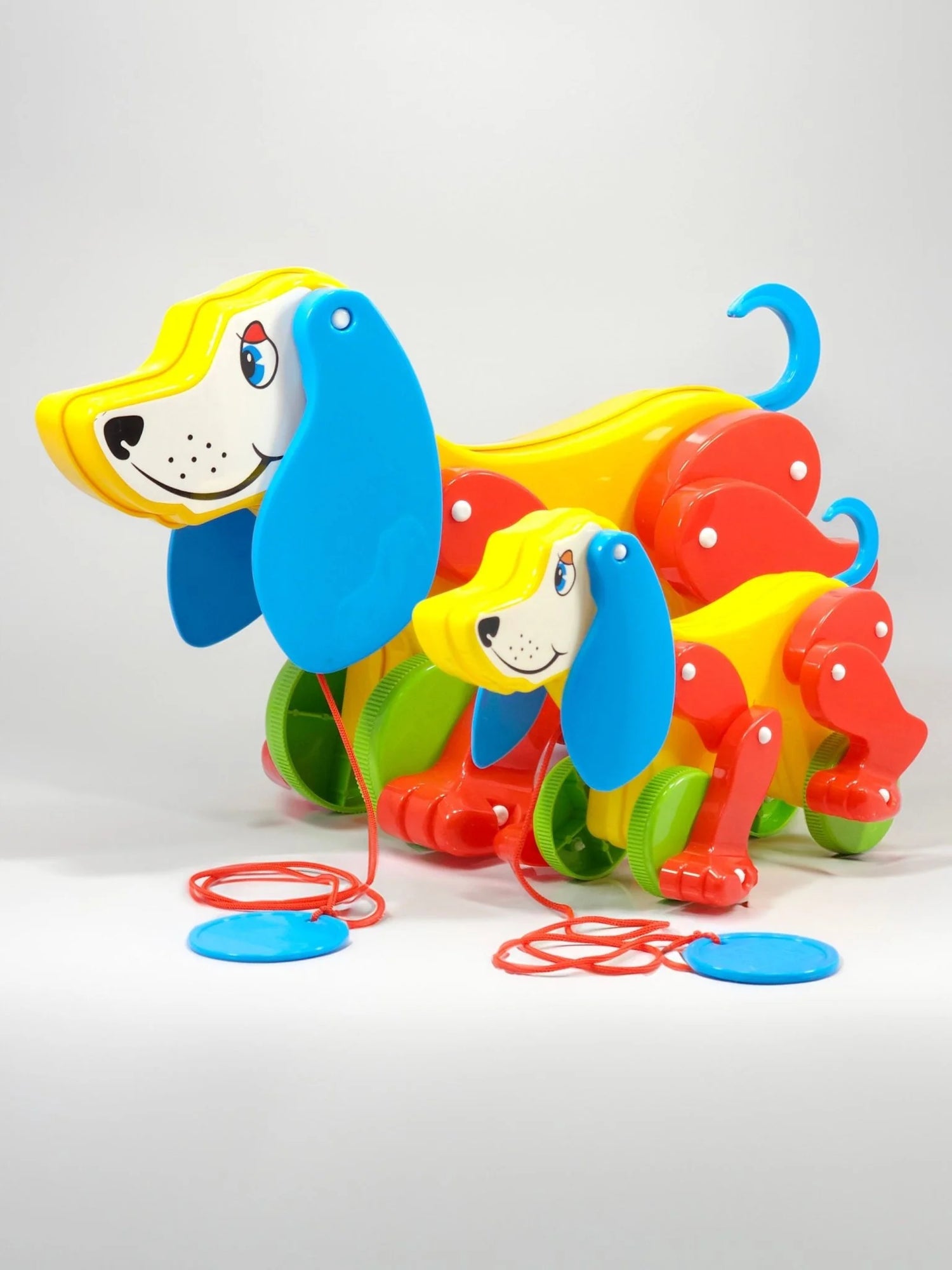 Colorful toy dog with a long tail on a white background