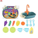 Children's toy kitchen set with sink, faucets, and various utensils on a white background.