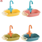 Set of four colorful children's sinks with faucets on a white background