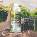 Bottle of Party Colours Bubble solution held by a hand with a scenic background