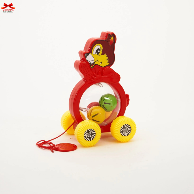 Toy lion with wheels and colorful balls on a white background