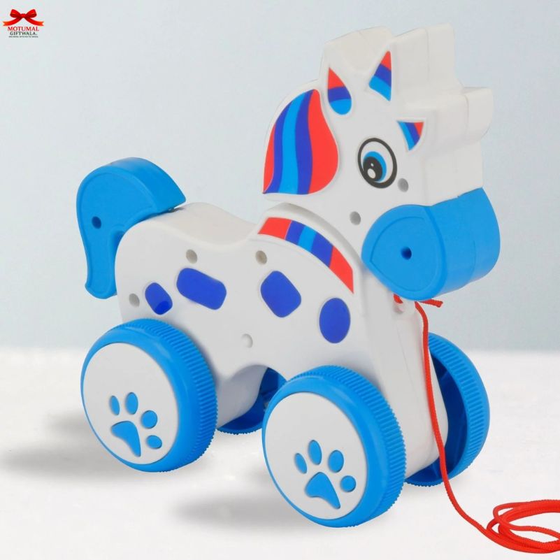 Toy unicorn with blue and red accents on a white background