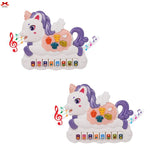 Two toy unicorns with musical instruments on a white background