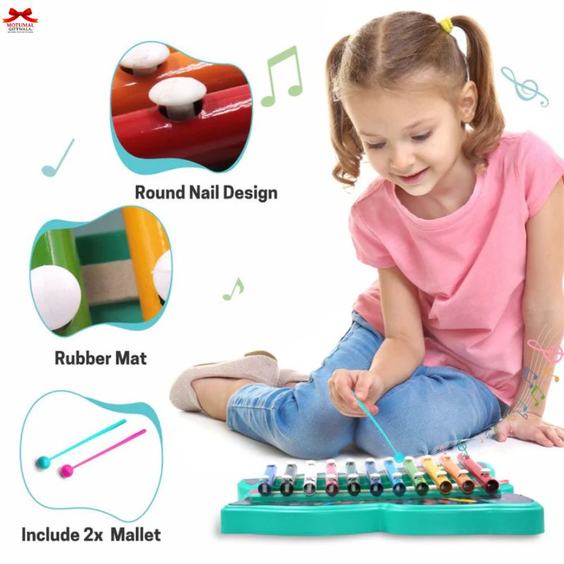 Child playing with a colorful xylophone toy, with close-up details of the round nail design and rubber mat.
