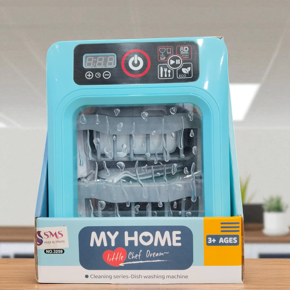 Front box view of My Home Little Chef Dream toy dishwasher with blue body and included utensils.