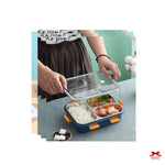 Person opening a bento box with compartments containing food on a table.