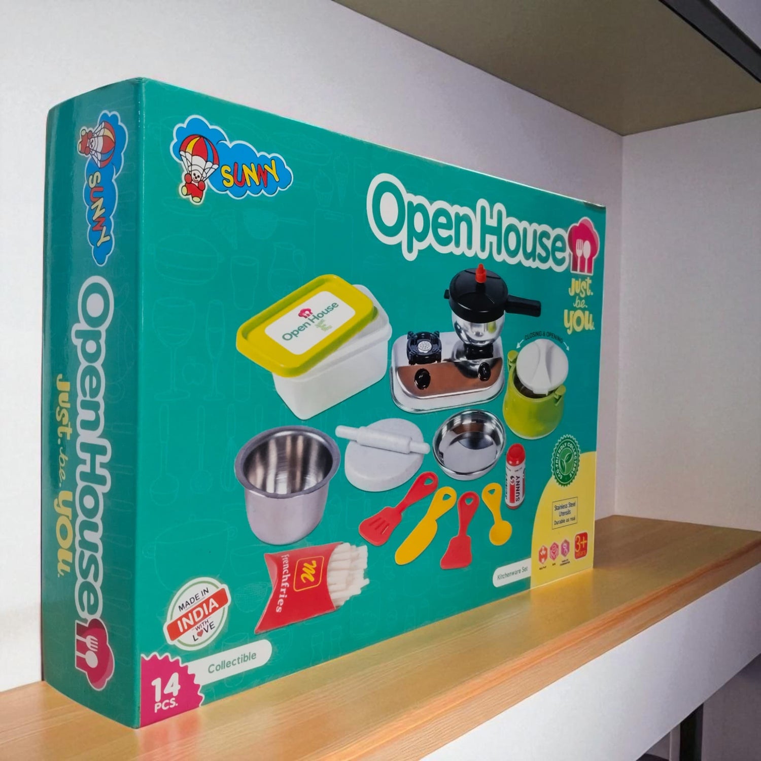 Side angled shot of Open House Kitchen Set toy box highlighting accessories and branding.