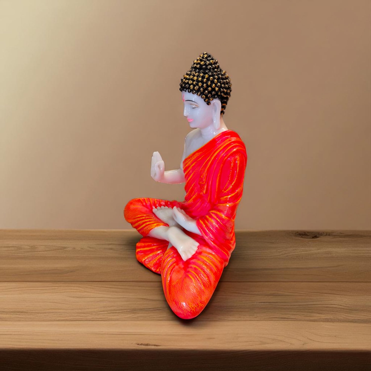 Meditating Buddha idol with orange robe – right side view