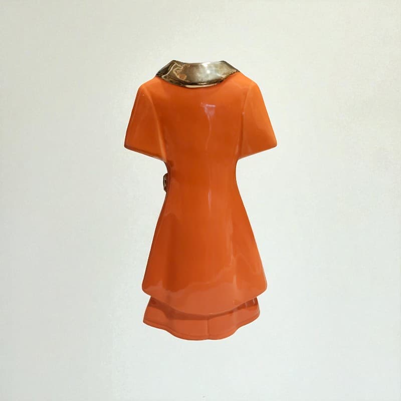Orange dress with metallic collar on a white background