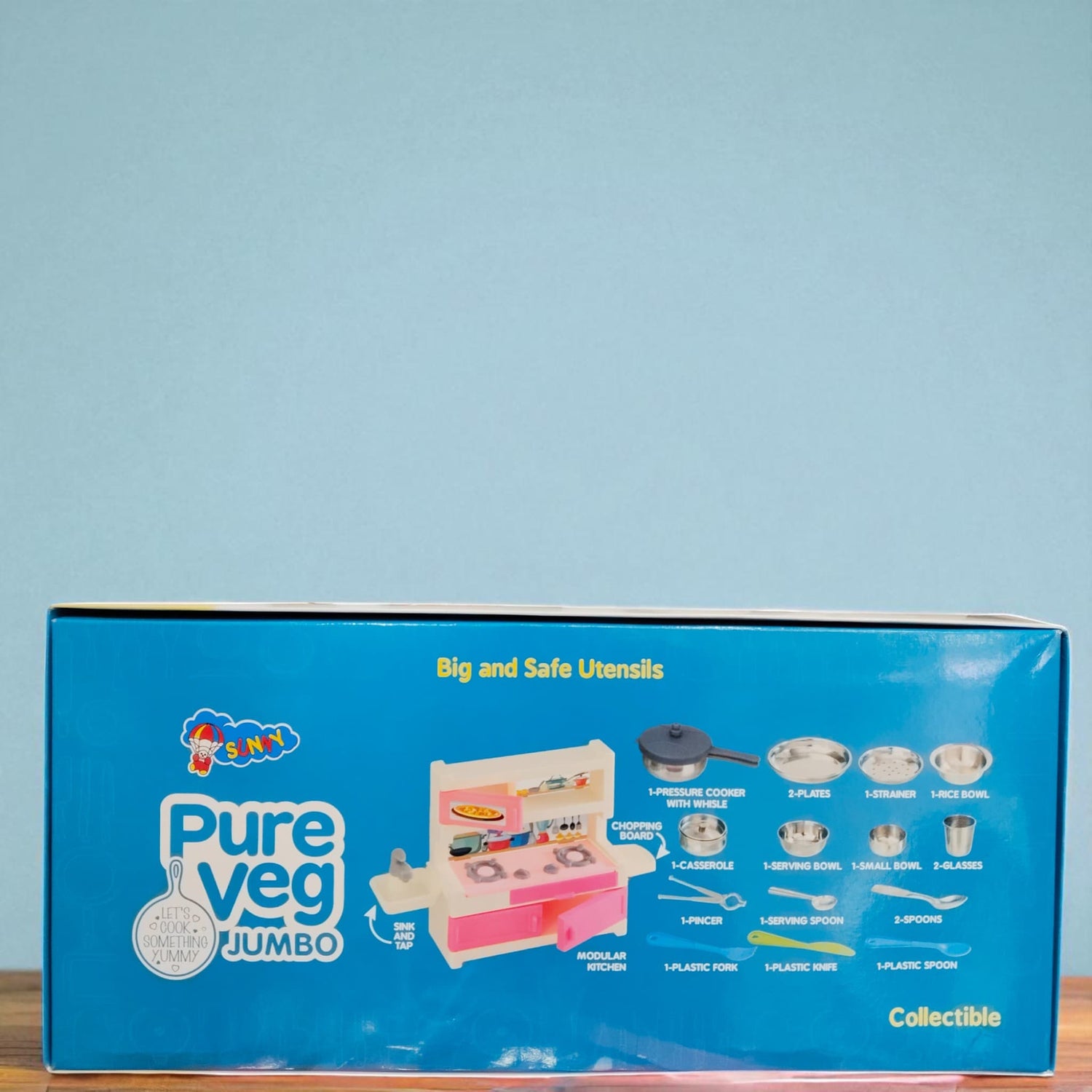 Back packaging view of Sunny Pure Veg Jumbo Kitchen Set with utensils list and blue background