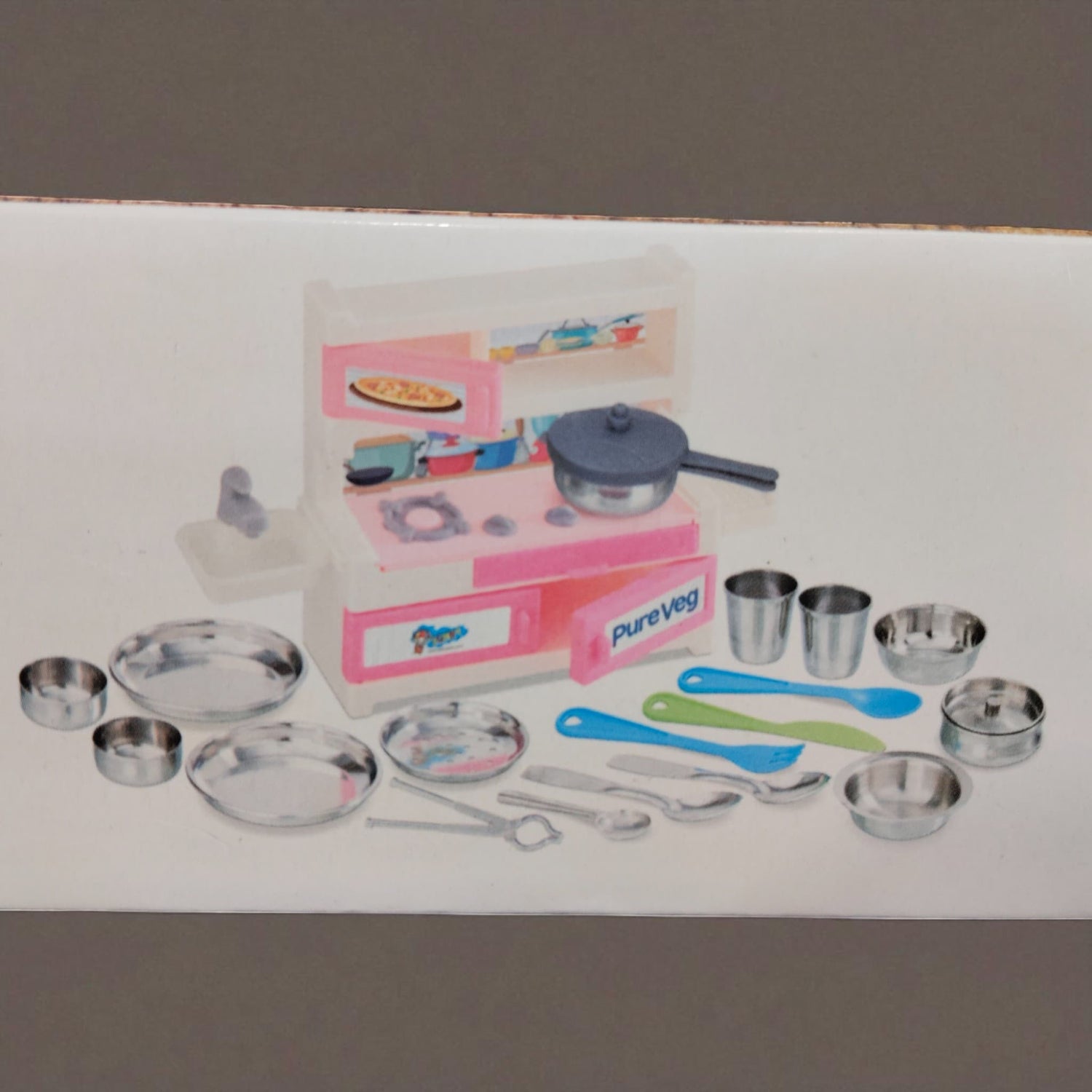 Complete accessories layout of Pure Veg Jumbo Kitchen Set including plates, spoons, and kitchen stove