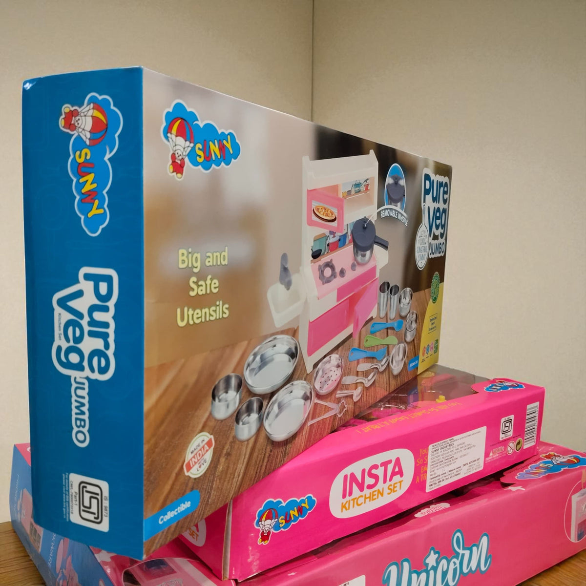Side angle image of Pure Veg Jumbo Kitchen Set packaging placed over Insta Kitchen Set box