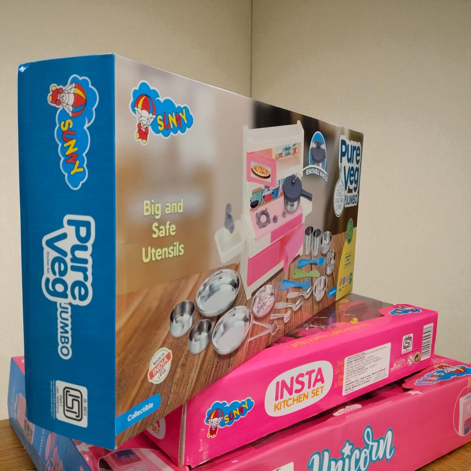 Side angle image of Pure Veg Jumbo Kitchen Set packaging placed over Insta Kitchen Set box