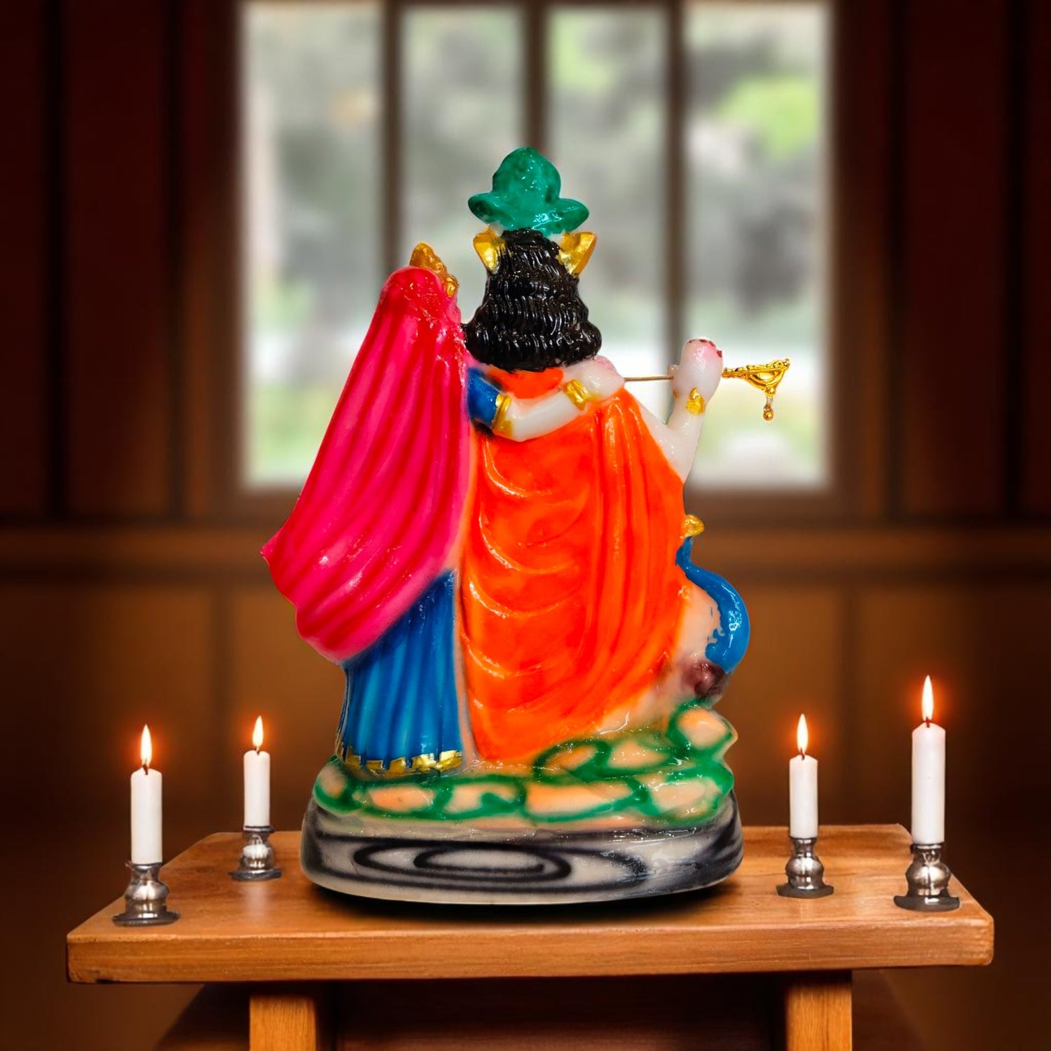 Back view of Radha Krishna statue showing vibrant attire and detailing