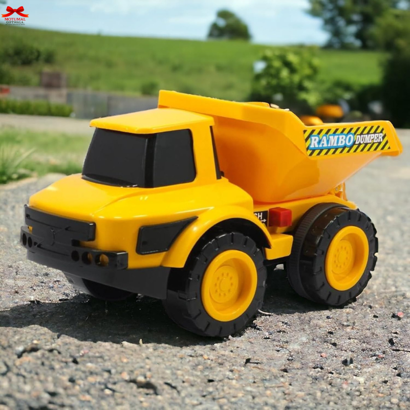 Yellow toy dump truck on a road with greenery in the background