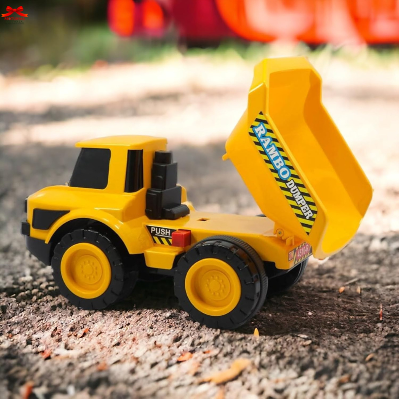 Toy bulldozer with 'Rambo Digger' branding on a dirt surface