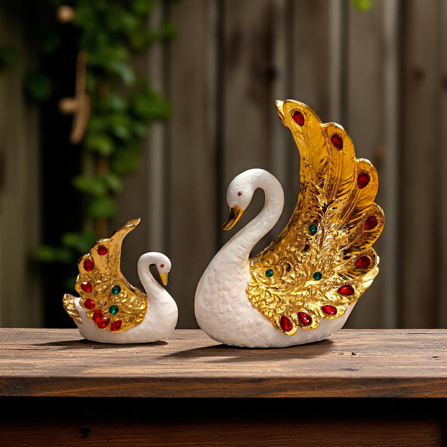 Front view of golden jeweled swan couple showpiece for gifting