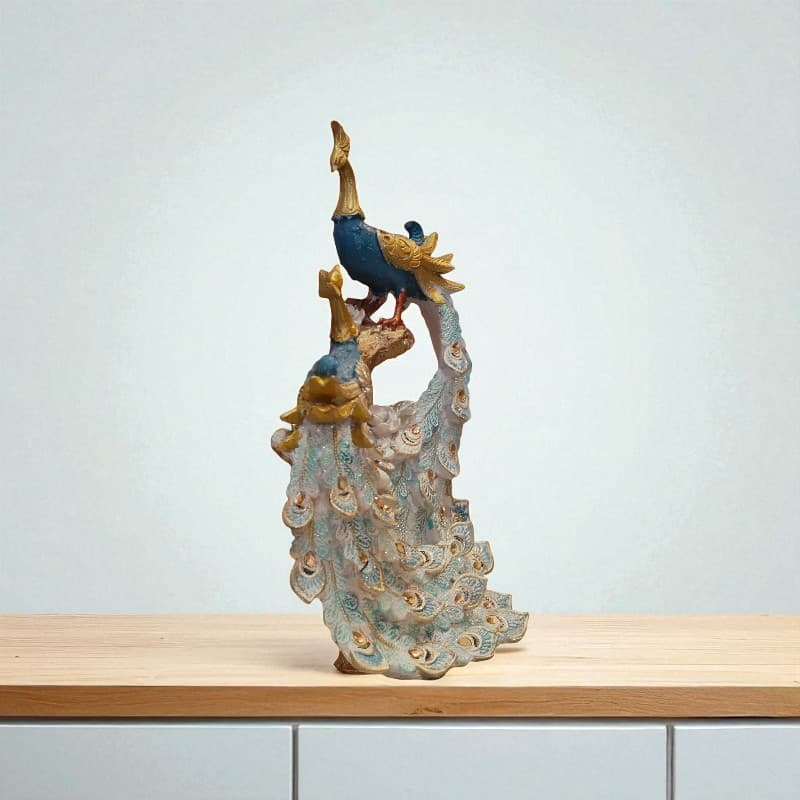 Decorative figurine of a peacock on a stand with a plain background