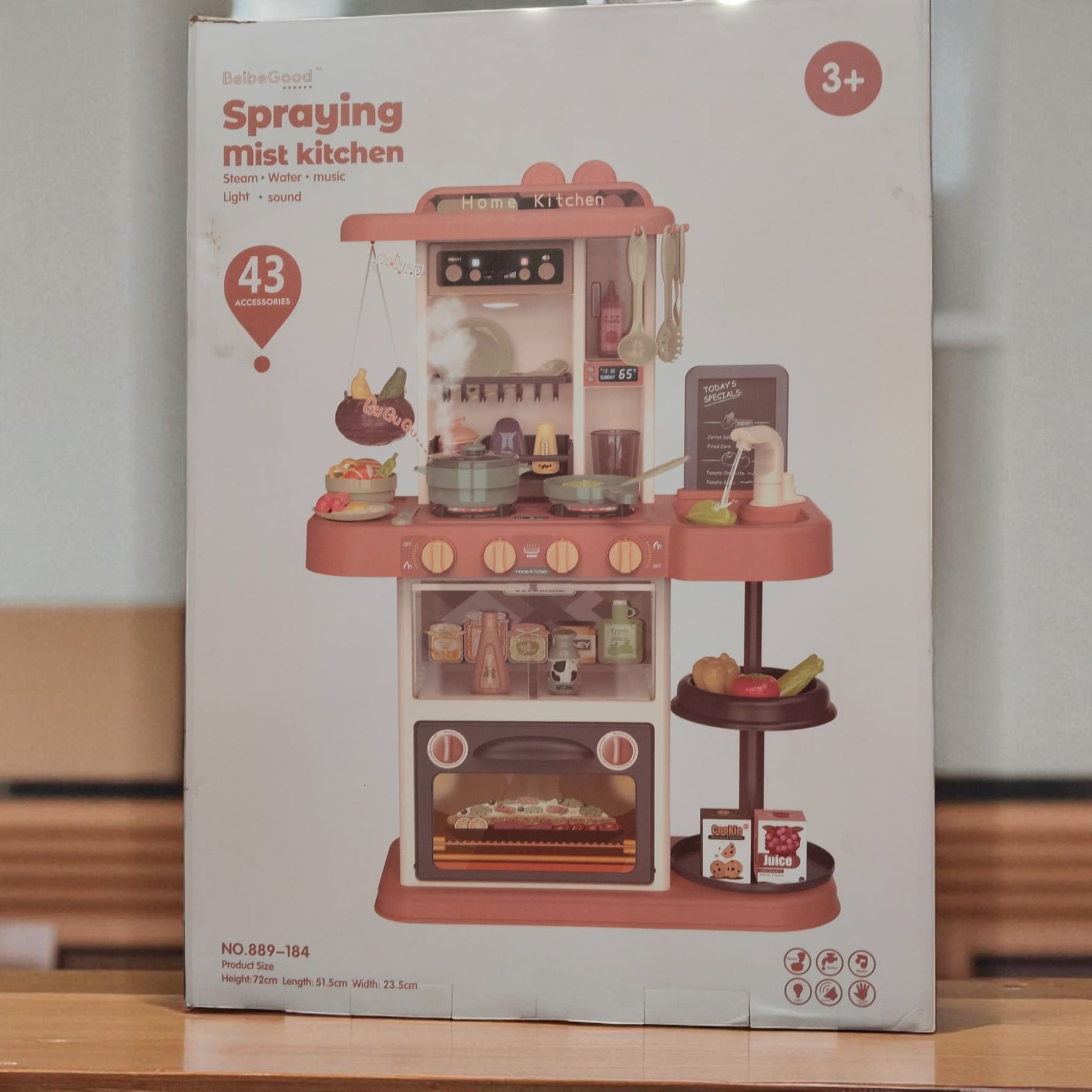 Front view of Spraying Mist Kitchen play set box displaying realistic kitchen features, stove, sink and utensils for kids.