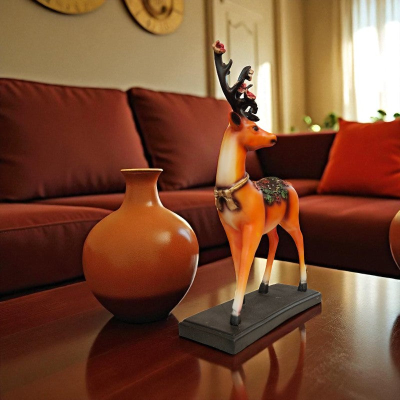 Decorative deer figurine and vase on a table with a blurred sofa and window in the background