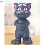 Gray cat-shaped figurine with arms crossed on a blurred background