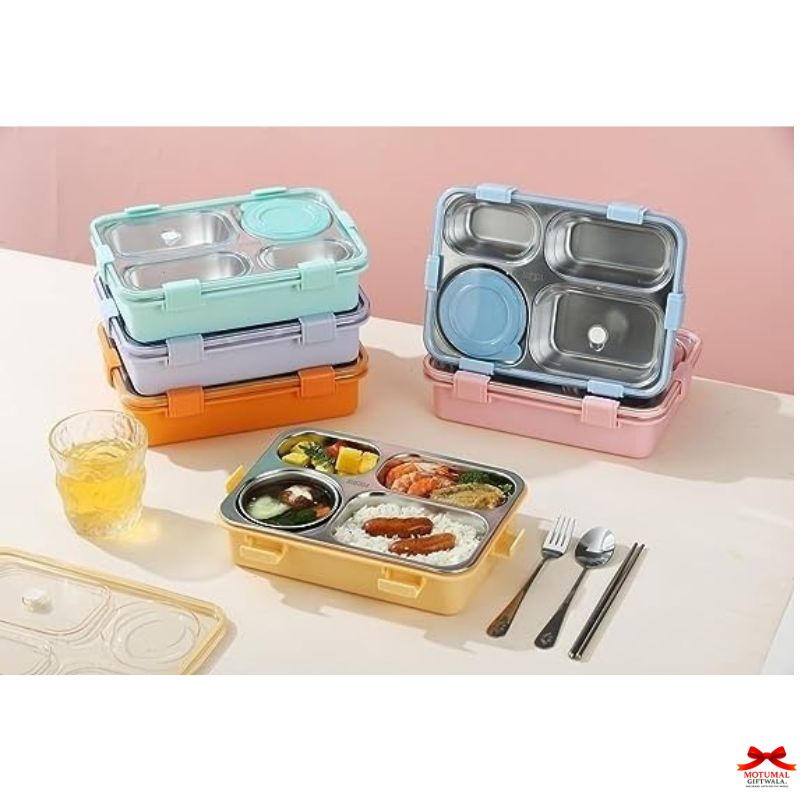 Set of colorful bento boxes with food and utensils on a light surface.