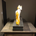 Rear view of the golden-tailed twin horse showpiece